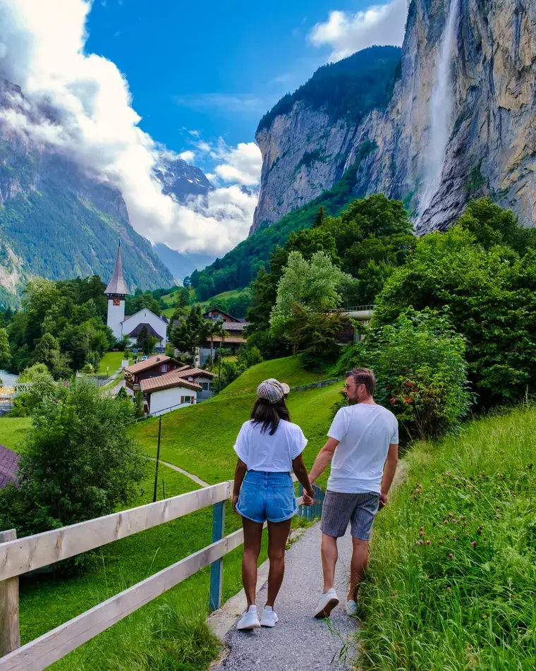 A couple looking out over the Lauterbrunnen valley in the Swiss Alps