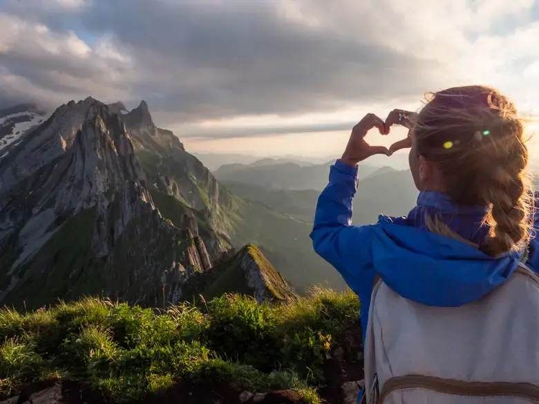 A traveller looking out over the Swiss mountains